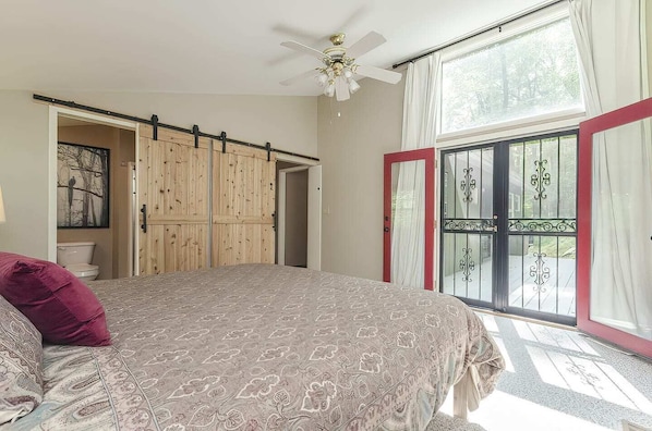 Large spacious bedroom that leads to the hot tub