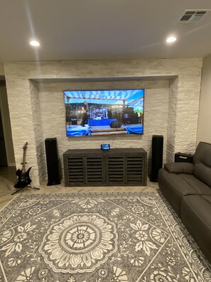86" TV; stereo system, Cable, DVD, NetFlix, Amazon Prime etc.
