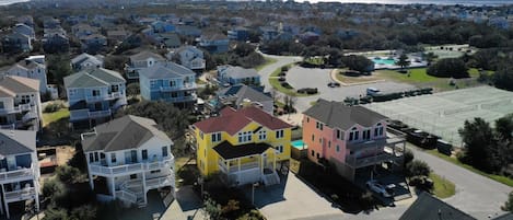 Our yellow house, 1 over from tennis courts and across the parking lot from pool