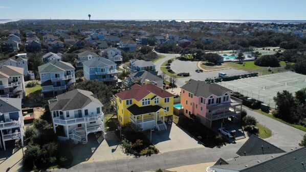 Our yellow house, 1 over from tennis courts and across the parking lot from pool