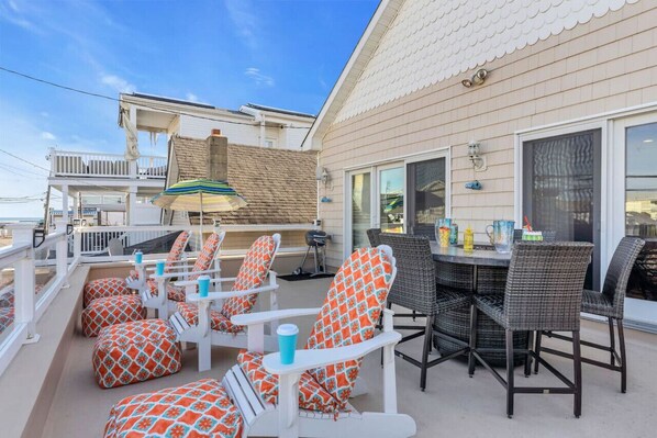 Front 2nd floor Patio balcony w/ gas firepit first block off boardwalk and beach