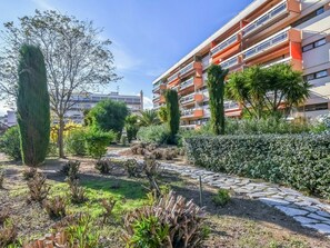 Plant, Sky, Building, Cloud, Window, Tree, Land Lot, Road Surface, Urban Design, Shrub