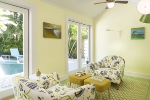 Chill in the air-conditioned sunroom, lounging in oversized chairs.