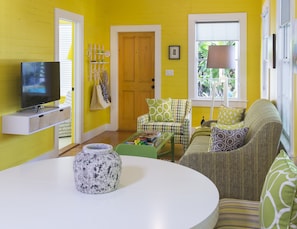 Hangout in the sunny yellow living area with expandable dining table/workspace.