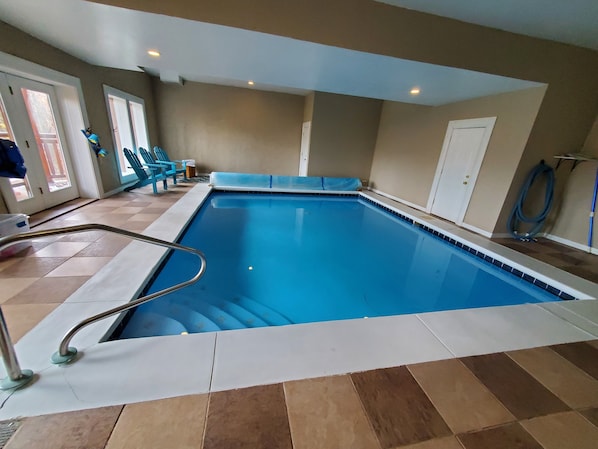 Heated Pool 18x22 lower area: pool seating, deck access, Amazon Alexa 1/2 bath.