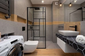 Comfortable bathroom with shower.