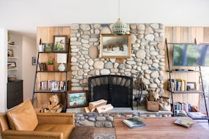Lovely wood-burning fireplace built with local river stone.