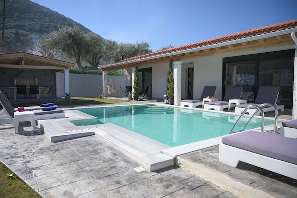 Dive into Bliss: Relax by the pool in the Mediterranean sun.