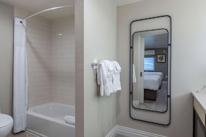 Full bathroom with LED mirror and bath products