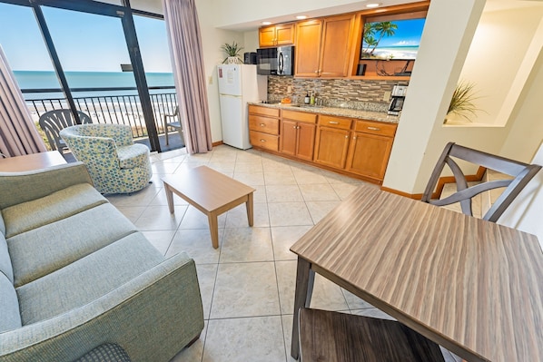 - Bright, breezy open concept living area with direct views of the Atlantic - Full kitchenette, dining nook, and cozy seating make it ideal for extended stays - Large sliding doors bring in tons of natural light and easy balcony access