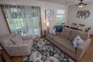 Cozy up in the living room and enjoy scenic views of the fairway.