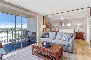 A large sliding glass door opens onto the fully screened lanai.