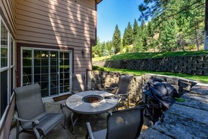 East facing patio with furniture and bbq grill.  Great spot for your morning coffee and is a nice shaded area from the late afternoon sun.