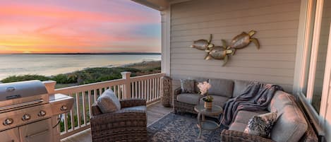 Large outdoor deck with new furnishings + grill. Perfect for sunsets & dolphins!