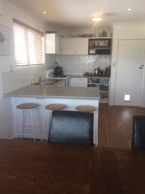 Open plan kitchen dining lounge
3 bar stools
Microwave
Coffee Machine