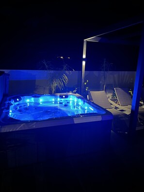 Spa at night, built  in Bluetooth speakers
