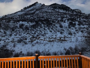 View of Lionshead Rock in winter from our patio at dusk.