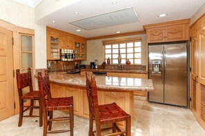 Spacious kitchen with granite countertops and stainless steel appliances