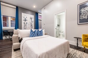 Open concept living, kitchen, and dining area with plenty of seating for you and your guests. 55” Samsung Smart 4K TV with streaming options and DIRECTV Entertainment. Dining table for two, and a sofa that converts to a full-size sleeper!