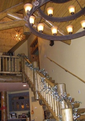 Grand entrance with log staircase