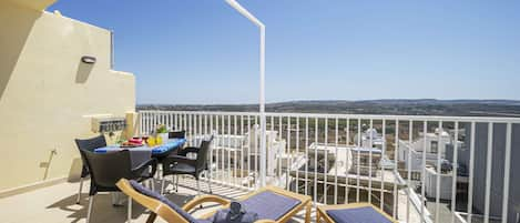 Sunny Terrace with panoramic and distant seaviews. 