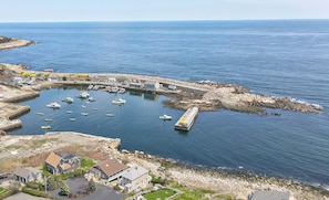 Watch the boats go by in Pigeon Cove.