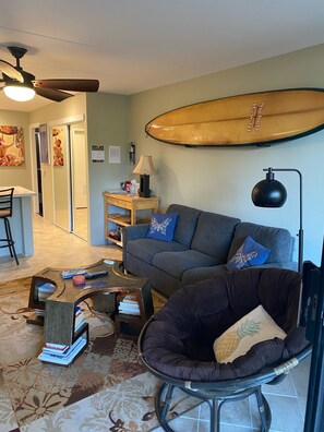 Fold out bed couch in living room. 