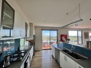 Kitchen with stocked pantry and appliances