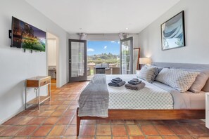 Master bedroom with french doors leading to backyard