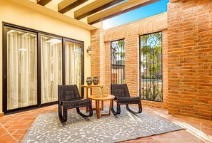 Outdoor patio opens to living room.
