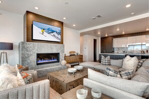 Living Room with Mountain Contemporary Furnishings, 65" Smart TV,  and Gas Fireplace