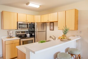 Tropical bamboo cabinet kitchen with counter stools