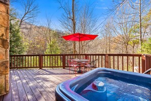 Spacious back deck with Hot Tub overlooking forested landscape