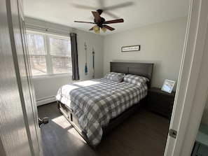 Master bedroom with a queen size bed. 