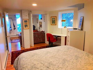 View from queen-size memory-foam bed; archway and door close for privacy.