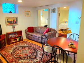 Living area with cable TV, WIFI, games.  Sofa converts to full-size bed.