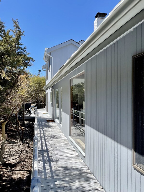 Down the south side of the house to the deck - living room inside the 1st window