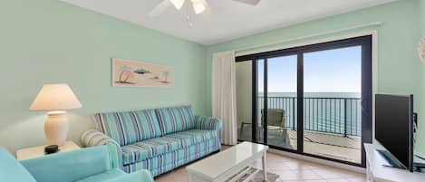 Living room has a queen sleeper sofa and beautiful Gulf view