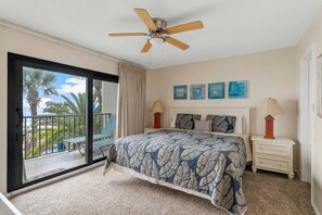 Beach views and private balcony access make this bedroom a top choice for a snooze