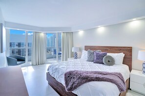 Master bedroom, king bed, desk, master bathroom, balcony access, Tv