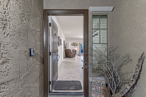 Front entrance to your home away from home with one garage space for your car..