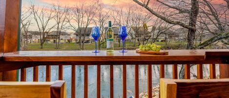 Enjoy a glass wine overlooking the river
