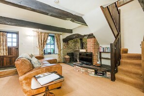 Ivy sitting room with log burner