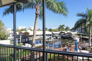 You can enjoy this waterfront view from your screened in lanai full of tropical beauty all day, every day. 