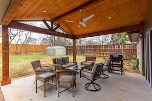Large outdoor Patio with Plenty of Seating and Grill