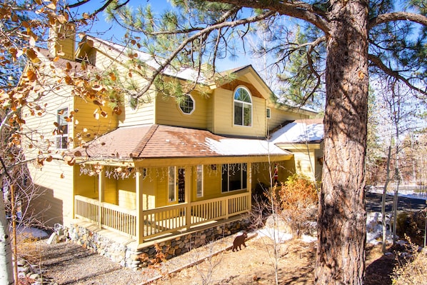 Skidder Trail Family Lodge - a SkyRun North Tahoe Property - Exterior Front Porch View - sunny covered porch