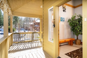 Entrance to home - enter into mudroom from front door, covered sunny porch with seating