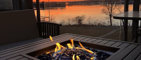 Enjoy a gorgeous lake view while seated comfortably around the fire table.
