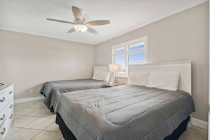 Bedroom with two full beds.