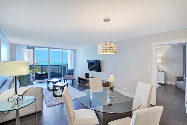 Living room, balcony access, Tv, dining area